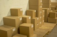 Moving boxes against a wall