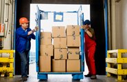Men moving a cart of moving boxes