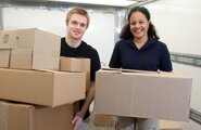Moving staff holding boxes