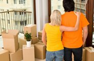 Couple looking at moving boxes