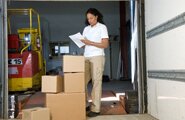 Worker looking over boxes of files